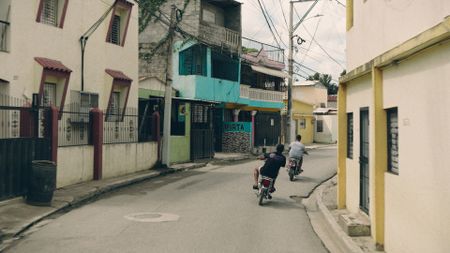 Riders speed through the streets of the Dominican Republic. (National Geographic)