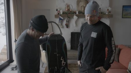 Travis Rice, right, and Jimmy Chin check out Travis' new snowboard line.(photo credit: National Geographic/Ross McDonnell)