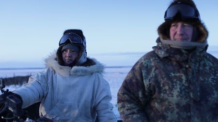 Chip and Agnes Hailstone glass the tundra while hunting for caribou.(BBC Studios Reality Productions, LLC/Ashton Hurlburt)