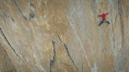 Alex Honnold makes an 'impossible' move on the pool wall.  (photo credit: National Geographic/Matt Pyecroft)