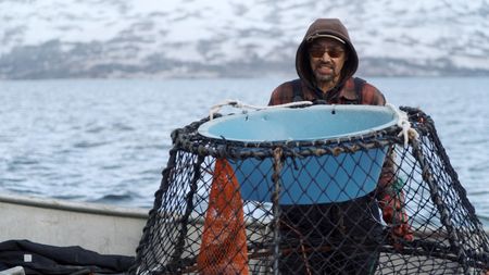 Marvin Agnot crabbing on his boat. (National Geographic)