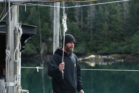 Matt Carlson fishes for salmon near the end of the summer troll season. (National Geographic/Wayne Moss)