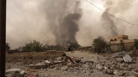 IRAQ - After leaving Qayarrah, ISIS sets oil fires as a parting gift for the villagers. (photo credit:  Junger Quested Films LLC/Nick Quested)