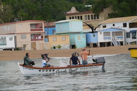 Christian Cooper takes to the sea to meet "Captain Pelican" who has a special bond with the seabirds on the west side of the island. (National Geographic for Disney)