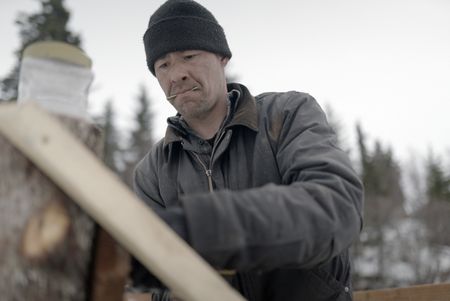 Joel Jacko builds a dock in the winter season. (National Geographic/Wayne Shockey)