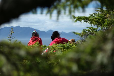 Veronica Arrants and Breanna Miethe pick berries. (National Geographic/Wayne Moss)