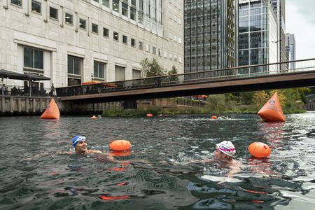 Antoni and Francesca take a cold swim at Canary Wharf, in the heart of London's financial district. (National Geographic/John Wendle)