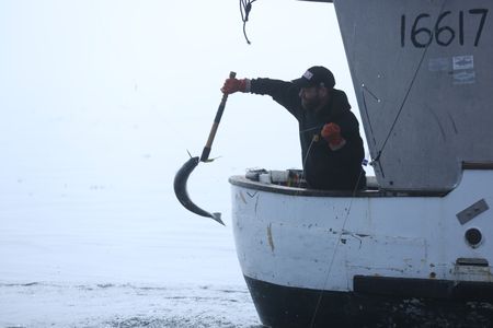 Matt Carlson fishes for salmon near the end of the summer troll season. (National Geographic/Wayne Moss)