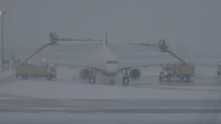 An aircraft is deiced. As well as disrupting the planeìs aerodynamics, un-removed ice can break up during a flight and fall into the engine, causing critical damage. (Arrow International Media Ltd & Cantina Media)
