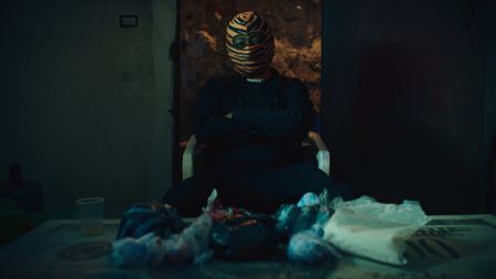 El Tigre, a drug dealer, speaks to Mariana van Zeller about using his drug profits to sponsor street racing teams. (National Geographic)