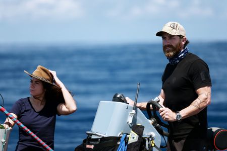 Melissa Marquez holds her hat as Aldo Kane steers the Zodiac. (National Geographic/Mario Tadinac)