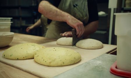 The baking team prepares Masala loaves at Rize Up bakery in San Francisco. (National Geographic/Ryan Rothmaier)