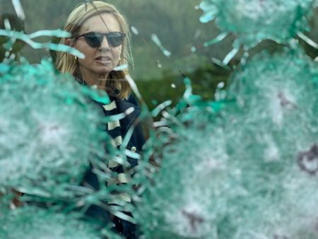 Mariana van Zeller looks through bullet-proof glass. (National Geographic)
