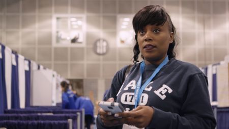 Dr. Serena McCalla in front of ISEF boards. (National Geographic)