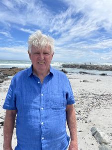 Charles Maxwell on the beach. (National Geographic/Robert Cowling)