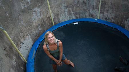 Angel Collinson smiles between trampoline jumps. (National Geographic/Elena Gaby)