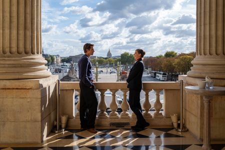 Antoni Porowski and Elsa Chabalaud chat on the balcony of Hotel Du Crillon. (National Geographic/Amy Browning)