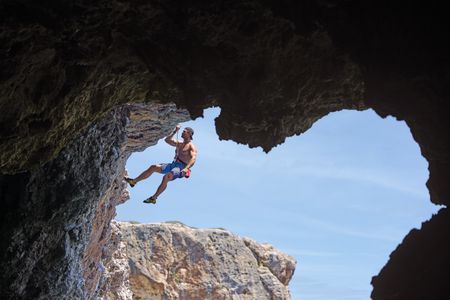 Chris recruits the help of Steph Davis, one of the best free solo climbers in the world, to train for a ëDeep Water Soloingì ñ no ropes, no safety equipment, just Chris climbing the rock face from the sea to the top of the cliff. This training will help prepare him for his final 600-foot climb on a wintery Swiss Alps Dam. (credit: National Geographic/Evan Paterakis)