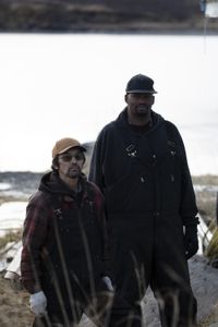Marvin Agnot and Glyndaril White, Jr. rebuild the side of Marvin's home that was damaged due to old age and rot. (National Geographic/Lauren Bird Dixon)