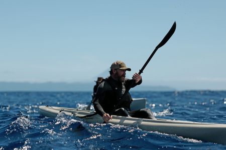 Melissa Marquez and Aldo Kane kayak in the ocean. (National Geographic/Mario Tadinac)