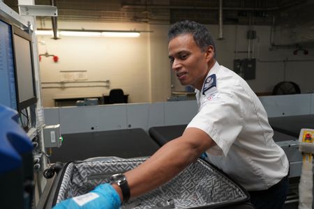Ash Gobin, Screening Officer, CATSA, in the Baggage area. (Arrow International Media Ltd & Cantina Media)