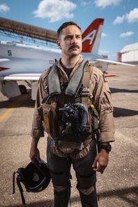Student LTJG Spenser Neel posing next to a T-45. (Credit: National Geographic/Freddie Claire)