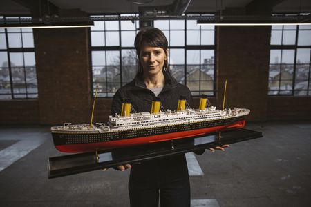 Jennifer Hooper stands with a model of RMS Titanic. (National Geographic/Freddie Claire)